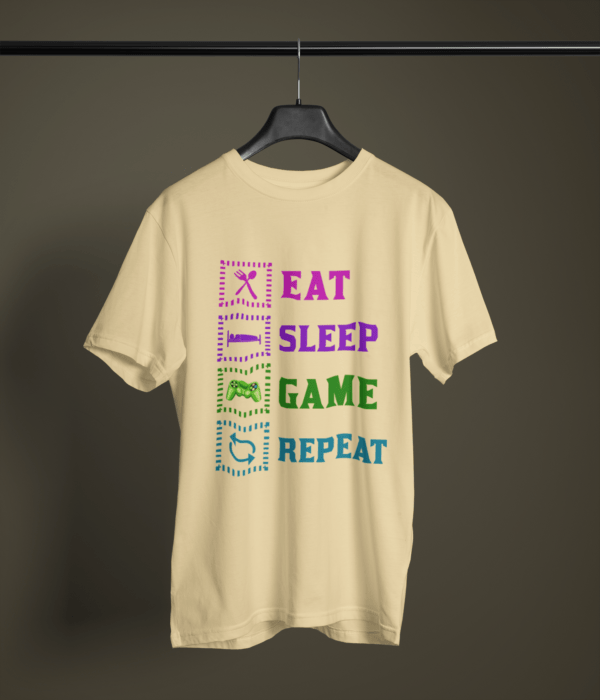 beige color eat sleep game repeat graphic tee on a hanger