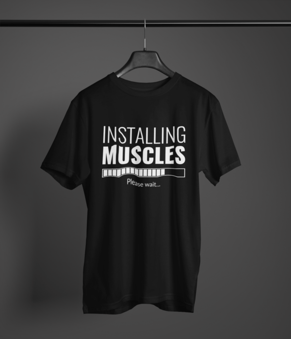 black color installing muscles printed tee on a hanger