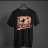 black color surfing graphic tee on a hanger