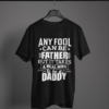 black-it-takes-real-man-to-be-a-daddy printed t-shirt on-a-hanger