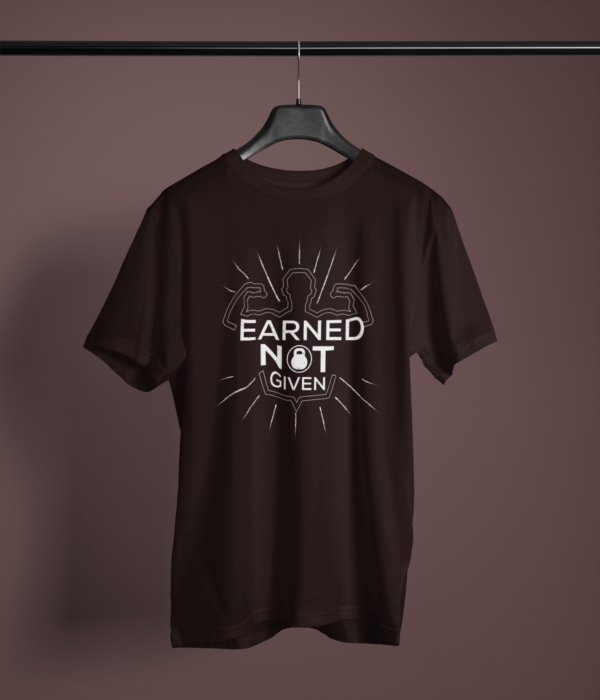 coffee brown color earned not given graphic tee on a hanger