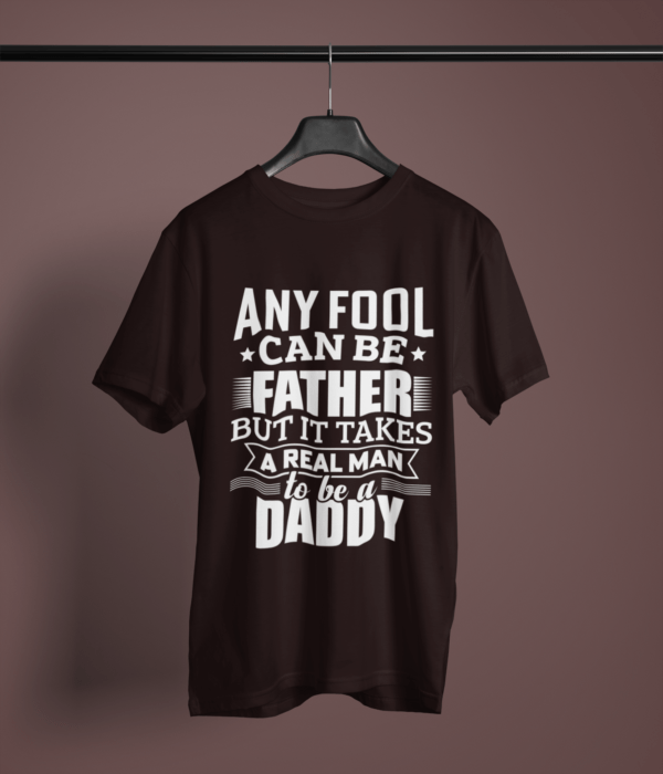 coffee-brown-it-takes-real-man-to-be-a-daddy printed-t-shirt on-a-hanger