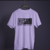 lavender color hustle grind and shine graphic printed t-shirt on a hanger